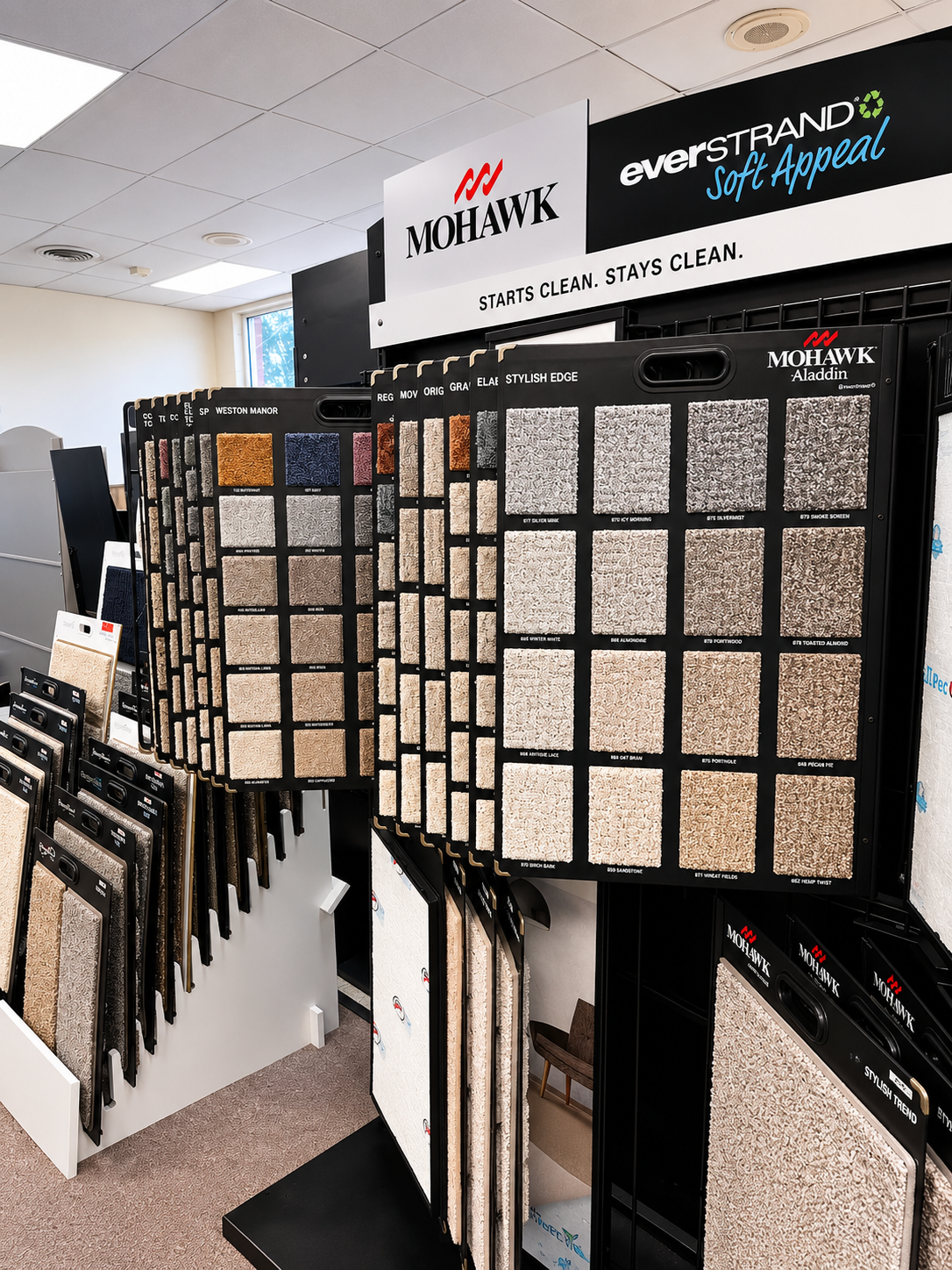 Carolina Floor Covering showroom interior with rows of laminate and luxury vinyl flooring display panels