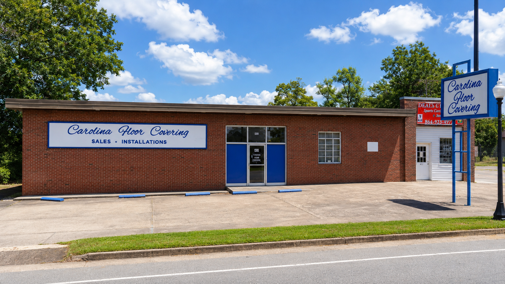 Exterior or warehouse view of Carolina Floor Covering store and inventory at 402 North Harper St.